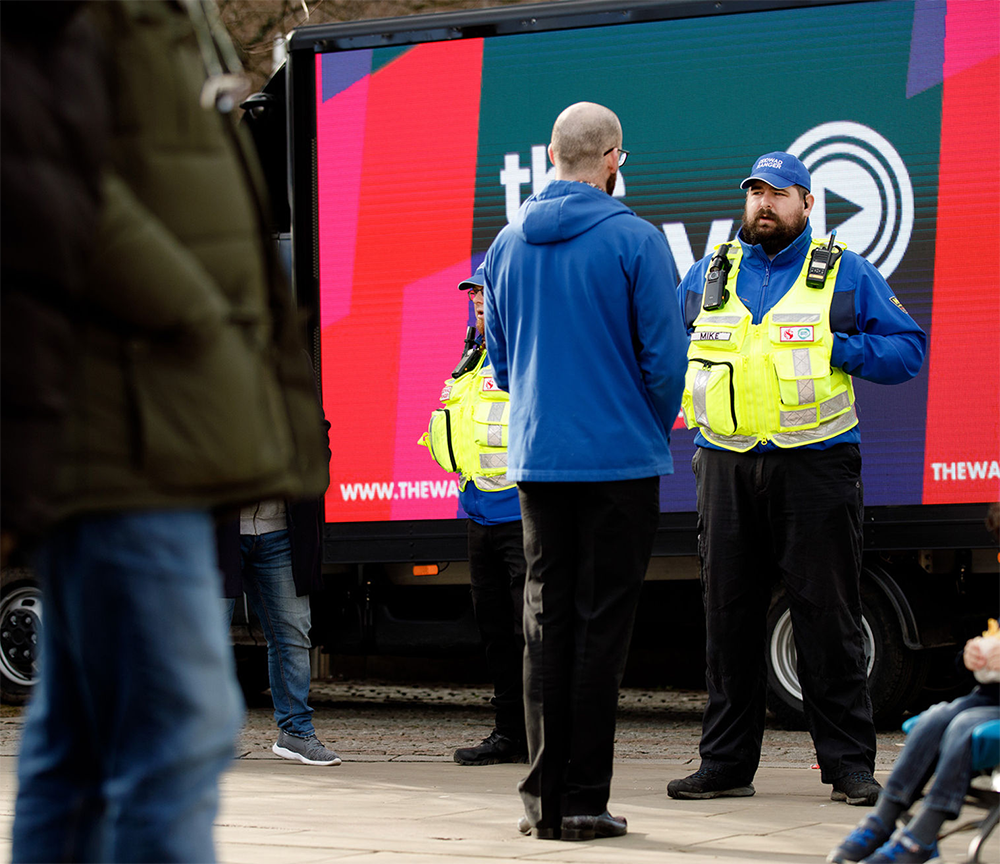 Swansea Against Business Crime Warden speaking to the public